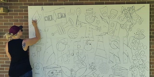 Dayna at work drawing the Artpark color-by-number mural