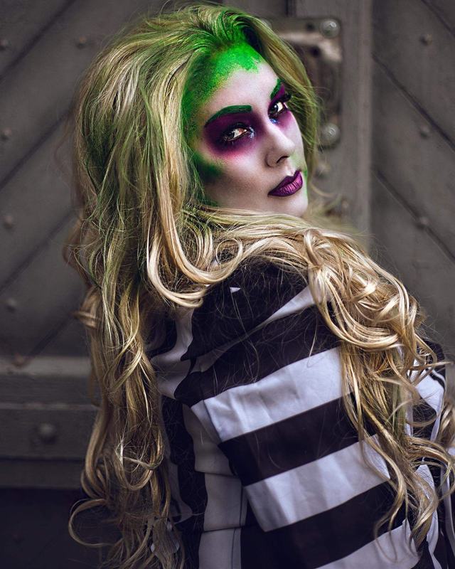 Beetlejuice-inspired look: striped suit, green-tinged hair and purple-ringed eyes