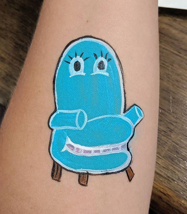 Cartoon blue armchair painted on a forearm