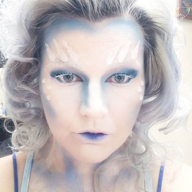 Frosted fantasy face in white and pale blue with blue lips