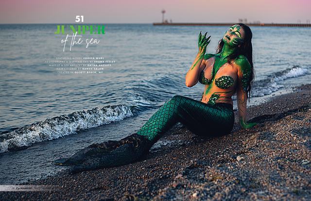 Juniper of the Sea spread: green-scaled mermaid on the shoreline