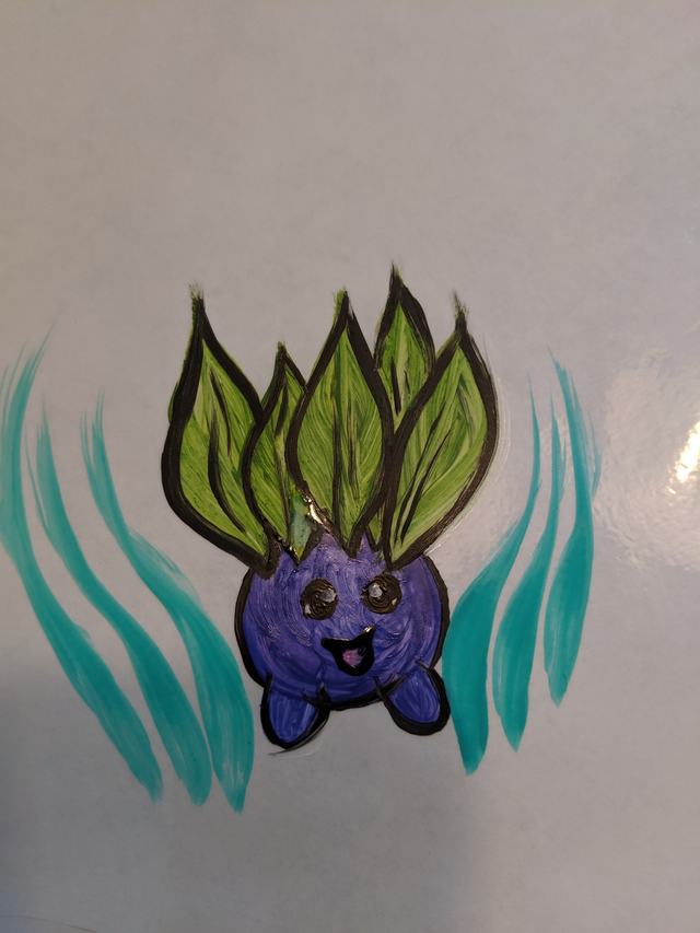 Leafy purple creature painted on paper as a design sample