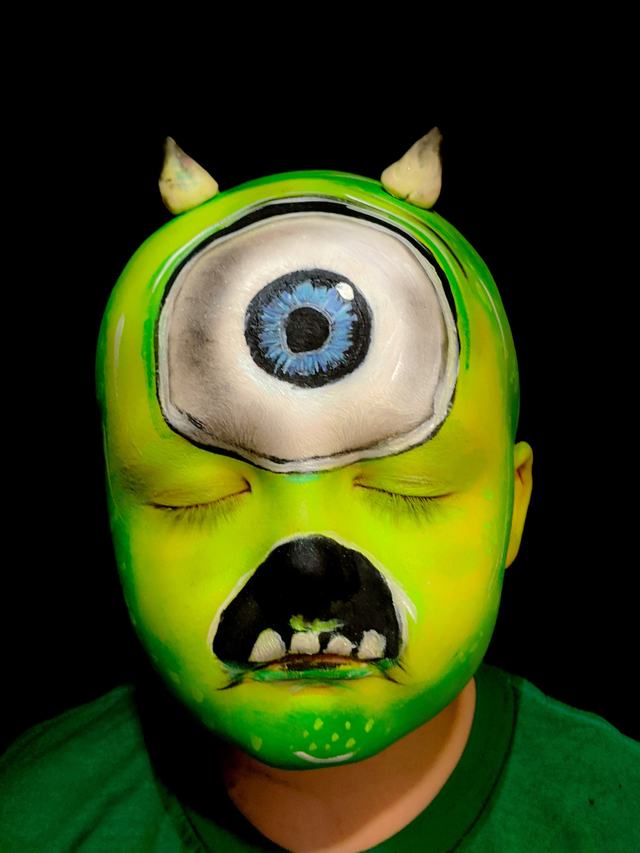 One-eyed green monster painted over the whole face