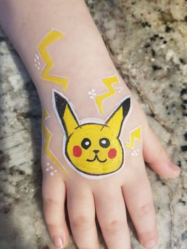 Pikachu with lightning bolts on the back of a hand