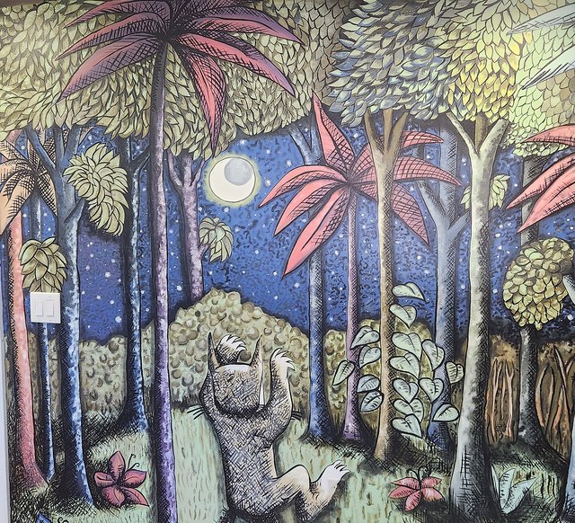 Hand-painted nighttime forest mural with a dancing Wild Thing beneath the moon